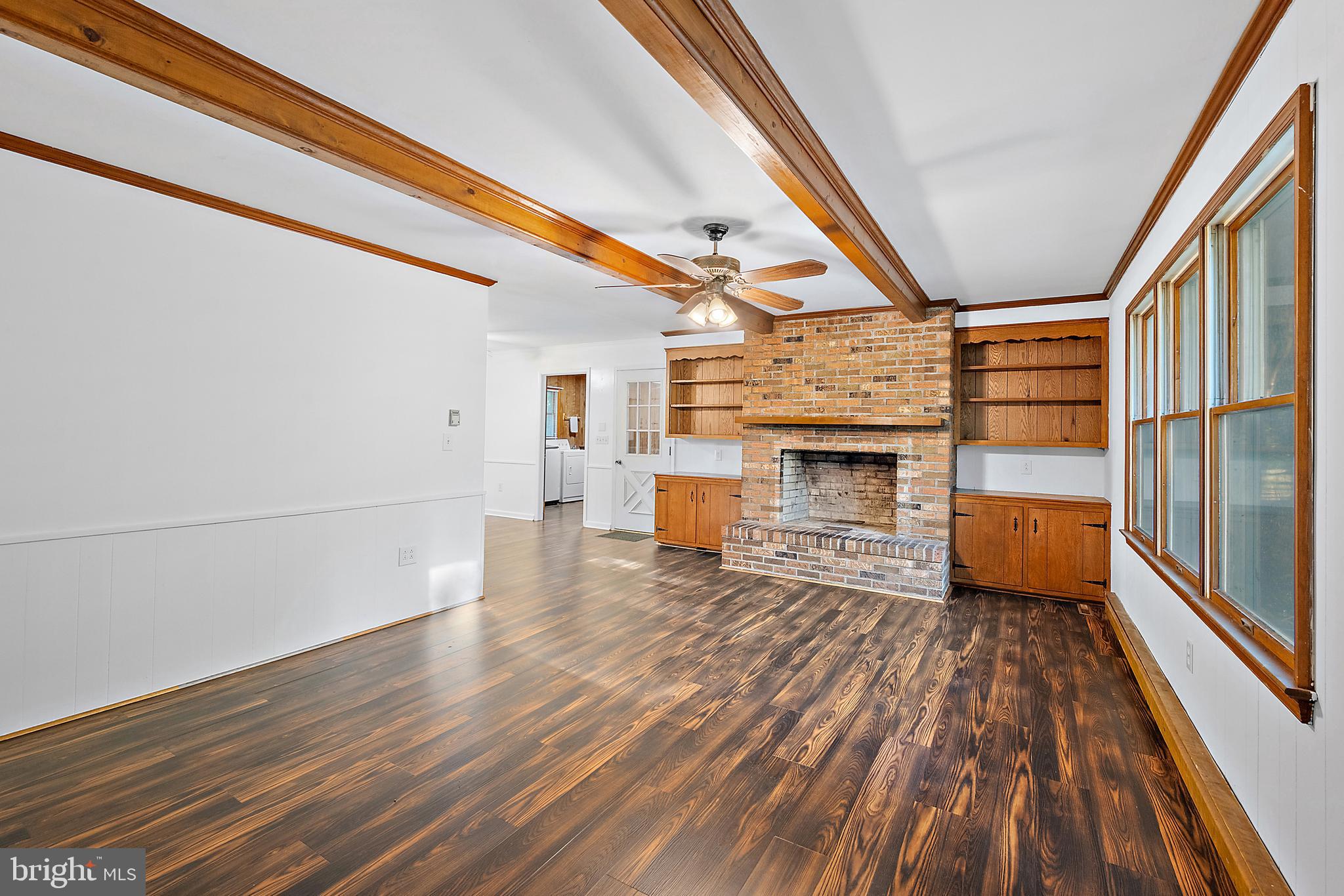 6181 Rockawalkin Road Salisbury, MD 21801 - Photo 8 of 65 a view of a livingroom with wooden floor and fireplace
