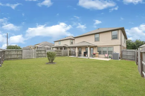 a view of a house with a yard porch and sitting area