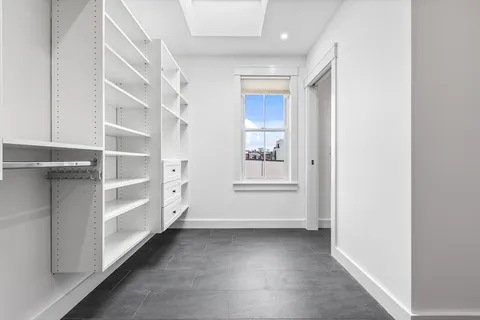 a view of a hallway with closet