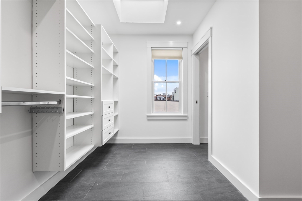 360 Athens Street, Unit 360 Boston, MA 02127 - Photo 21 of 27 a view of a hallway with closet
