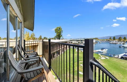 a view of a balcony with furniture