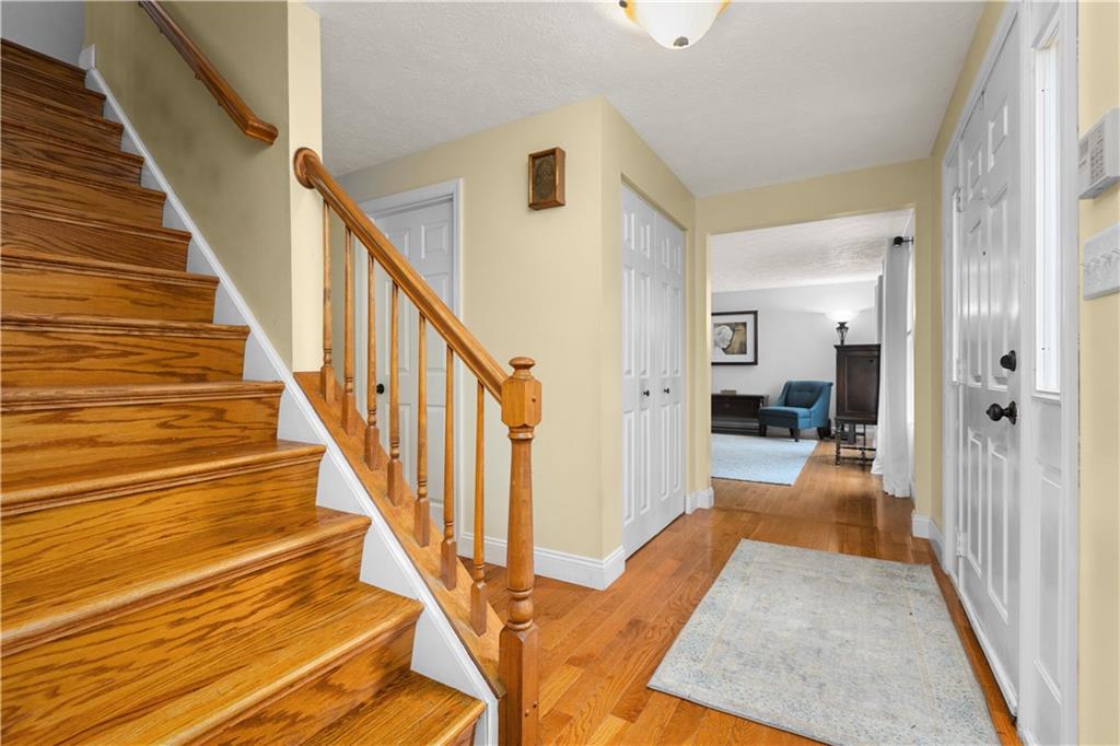 203 West Cruikshank Road Butler, PA 16002 - Photo 3 of 32 a view of a hallway with wooden floor and staircase