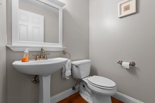 203 West Cruikshank Road Butler, PA 16002 - Photo 7 of 32 a bathroom with a sink a toilet and mirror