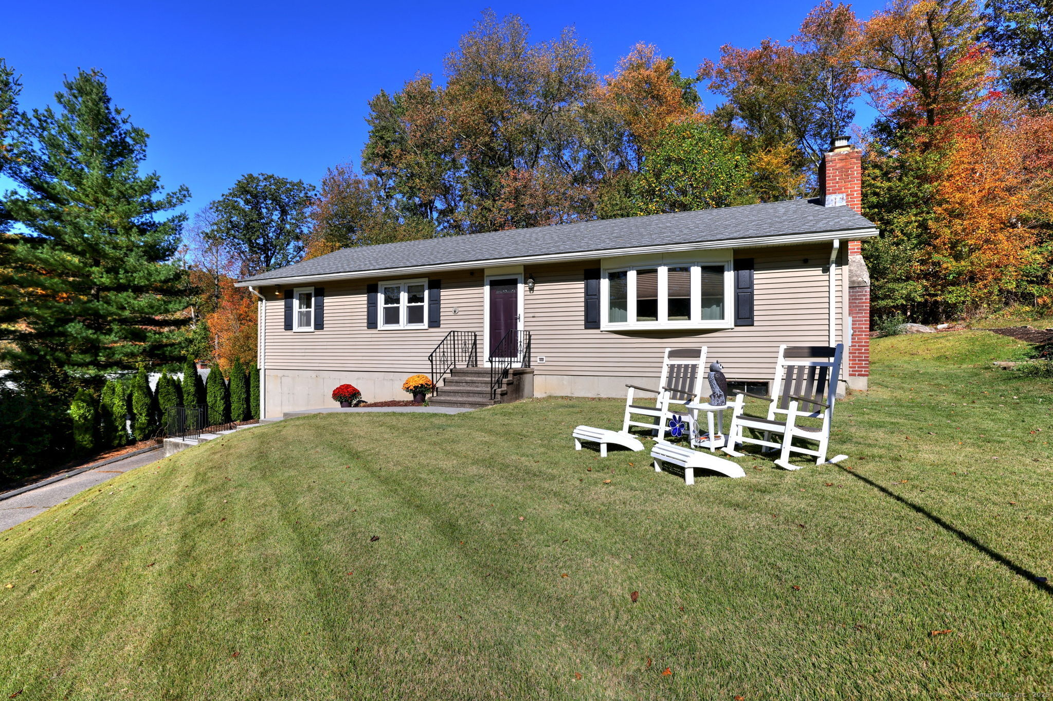78 Hillside Drive Beacon Falls, CT 06403 - Photo 1 of 40 a front view of a house with a garden and chairs