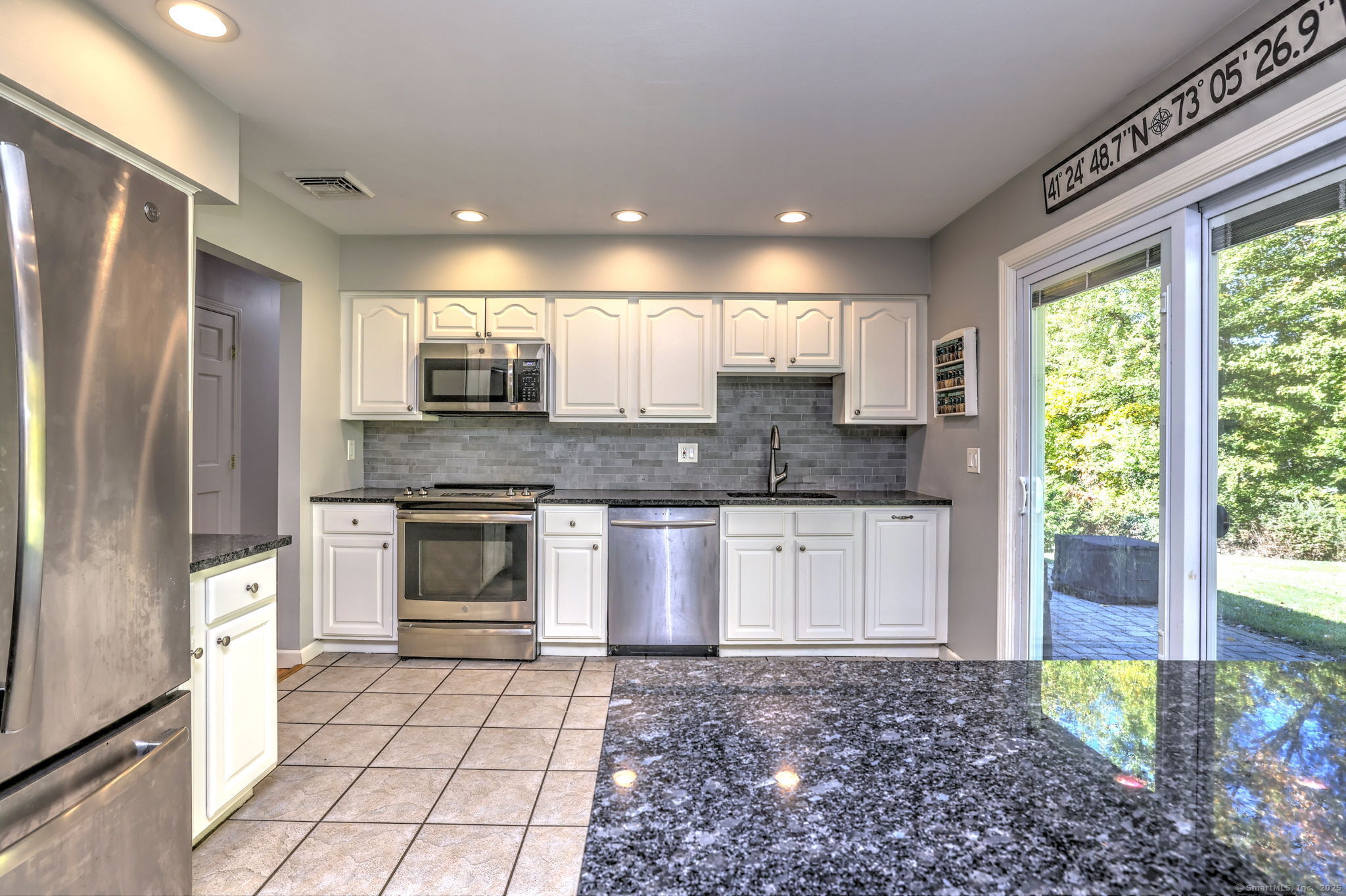 78 Hillside Drive Beacon Falls, CT 06403 - Photo 12 of 40 a kitchen with stainless steel appliances granite countertop a stove a sink and a refrigerator