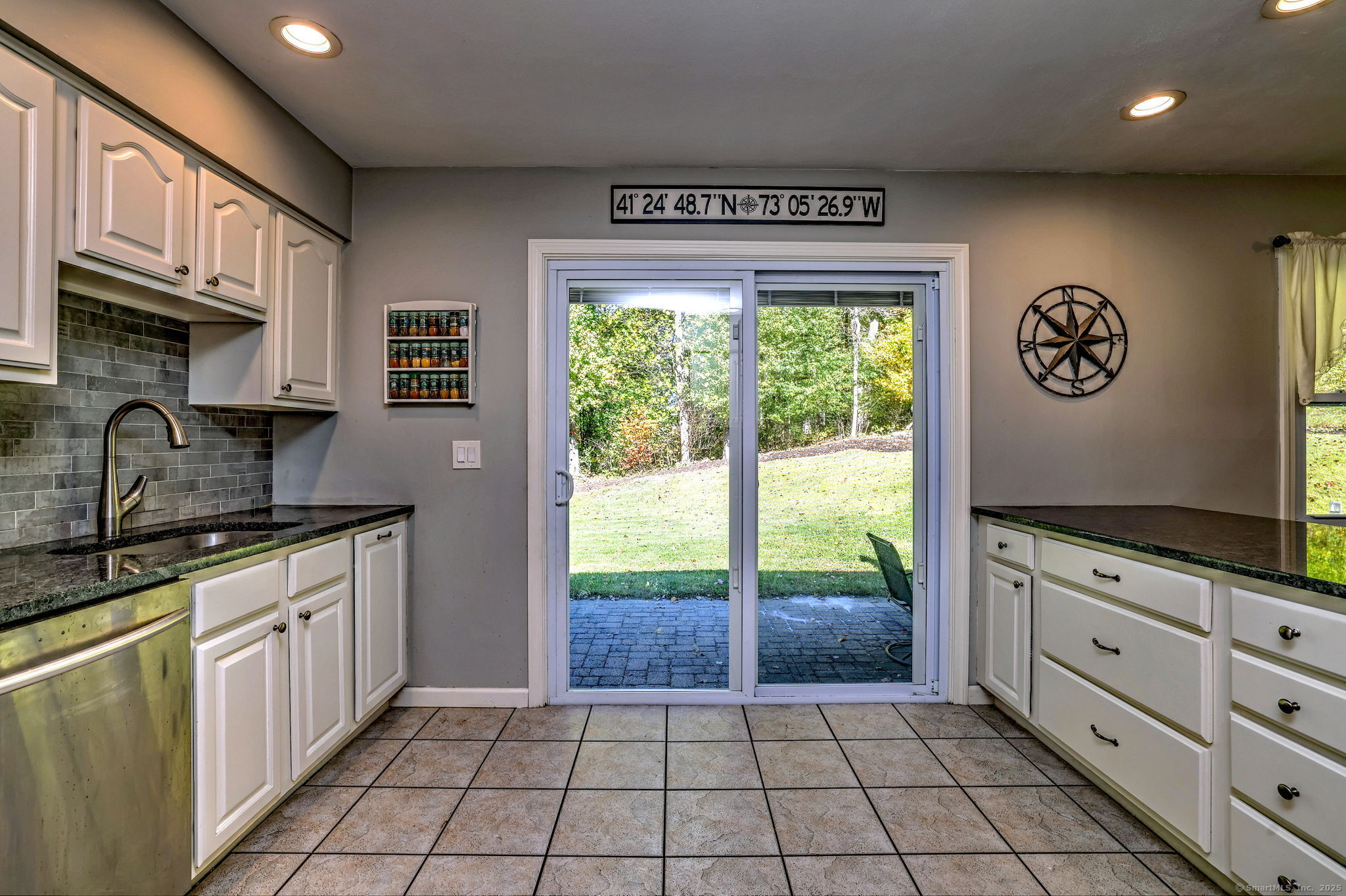 78 Hillside Drive Beacon Falls, CT 06403 - Photo 17 of 40 a kitchen with stainless steel appliances granite countertop a stove a sink and a microwave