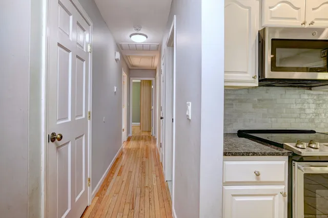 a view of a kitchen from the hallway