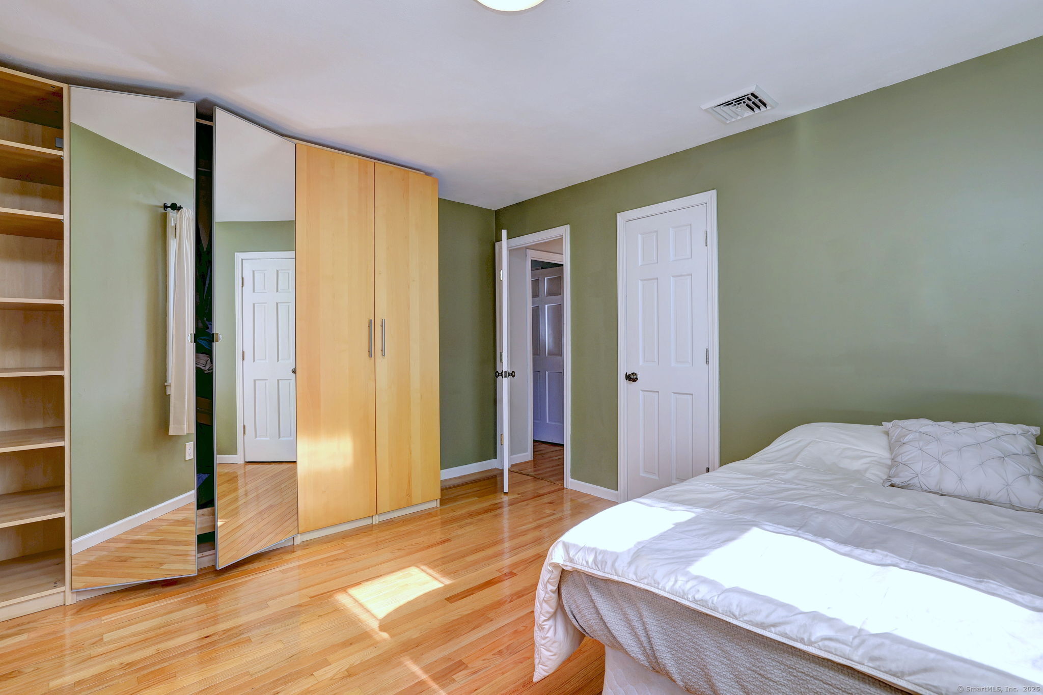 78 Hillside Drive Beacon Falls, CT 06403 - Photo 23 of 40 a bedroom with a bed and wooden floor