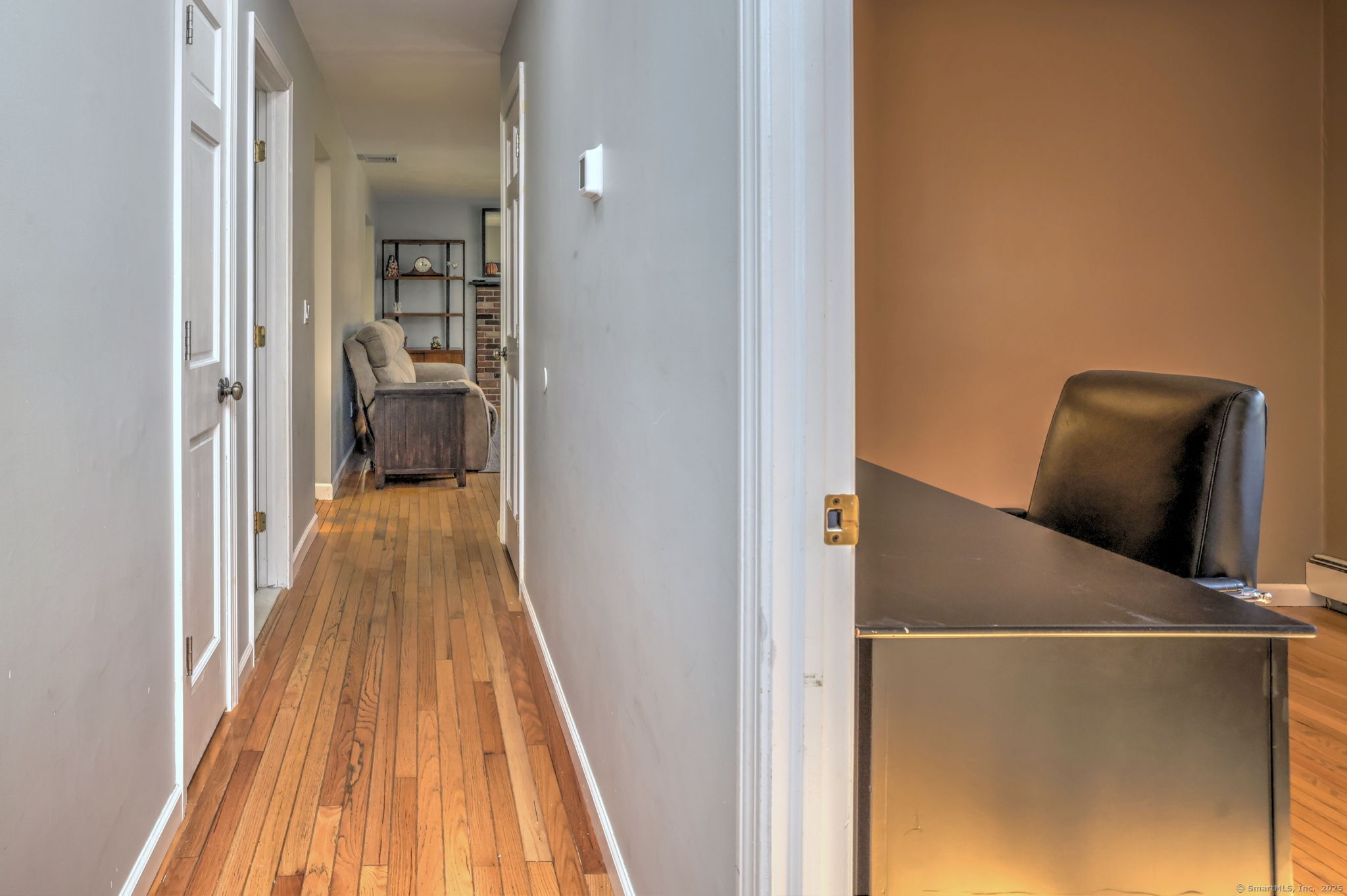 78 Hillside Drive Beacon Falls, CT 06403 - Photo 24 of 40 a view of a hallway with wooden floor and staircase