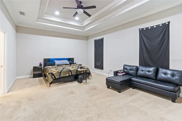 a bedroom with a bed and a couch