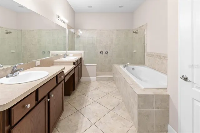 a kitchen with a sink cabinets and appliances