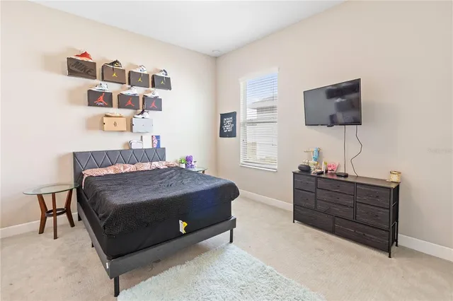 a bedroom with a bed and a mirror