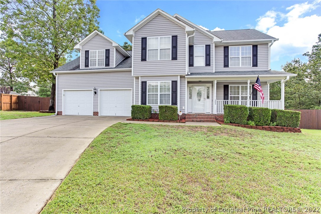 305 Pender Road Spring Lake, NC 28390 - Photo 1 of 45 a front view of a house with a yard and potted plants