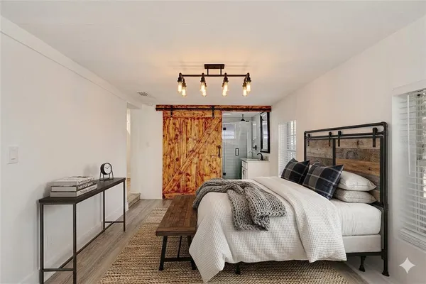 a bedroom with a bed and window