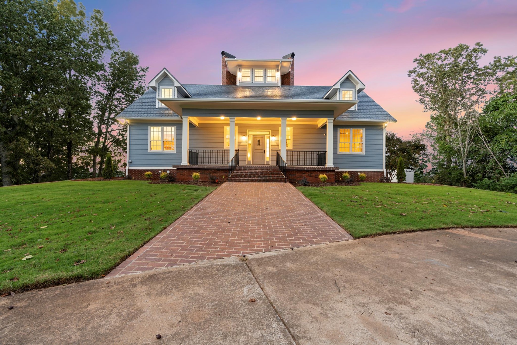 a front view of a house with yard