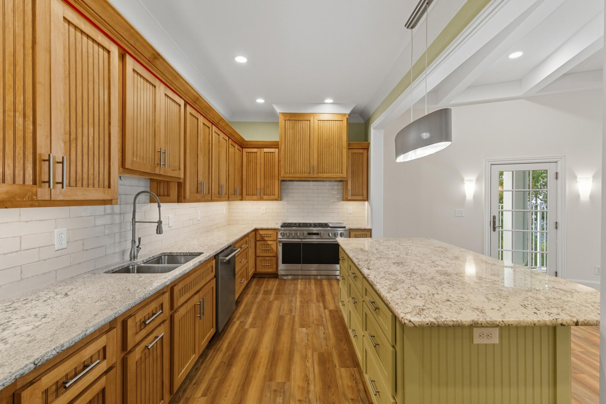 583 Bell Point Road Laceys Spring, AL 35754 - Photo 13 of 50 a kitchen with granite countertop a sink stove and cabinets