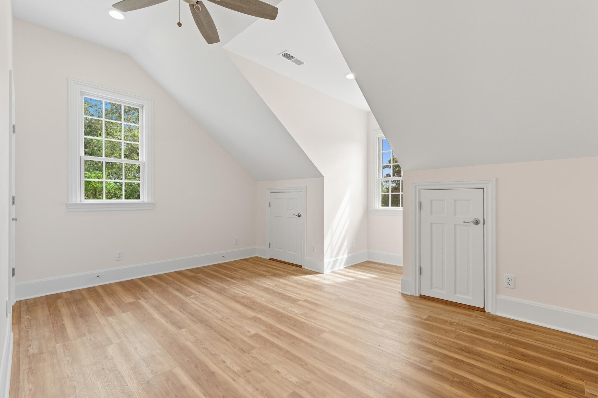 583 Bell Point Road Laceys Spring, AL 35754 - Photo 27 of 50 an empty room with wooden floor cabinet and windows