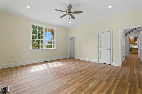 a view of hallway with wooden floor