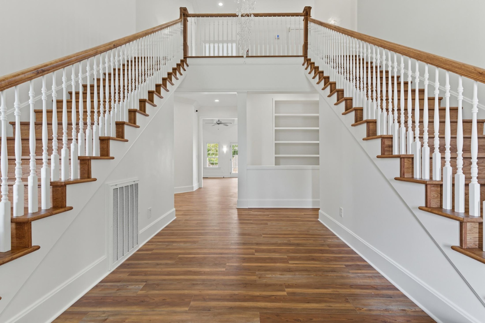 583 Bell Point Road Laceys Spring, AL 35754 - Photo 4 of 50 a view of staircase with lots of frames on wall and wooden floor