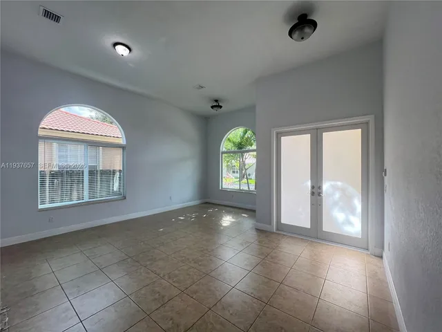 a view of an empty room with a window