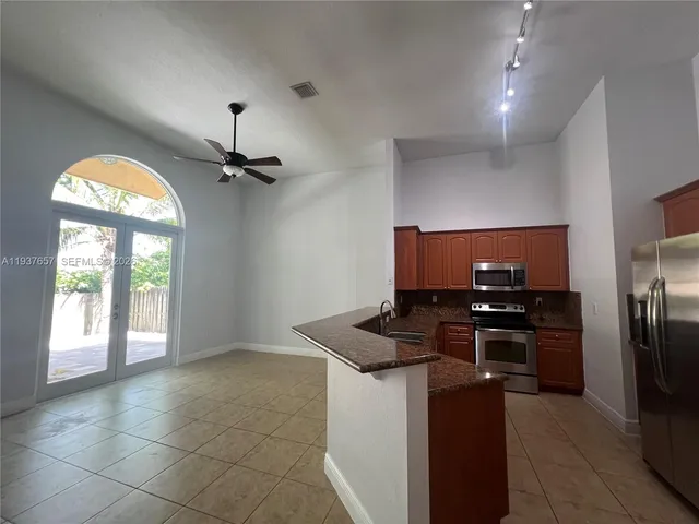 a view of a livingroom with a flat screen tv