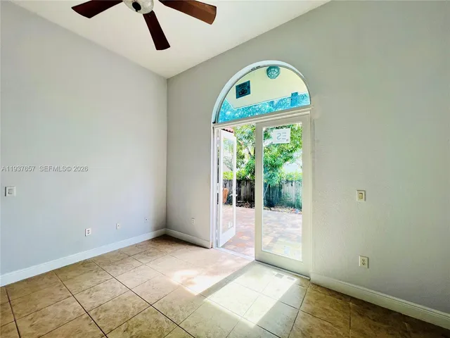 a bathroom with a bathtub sink and mirror