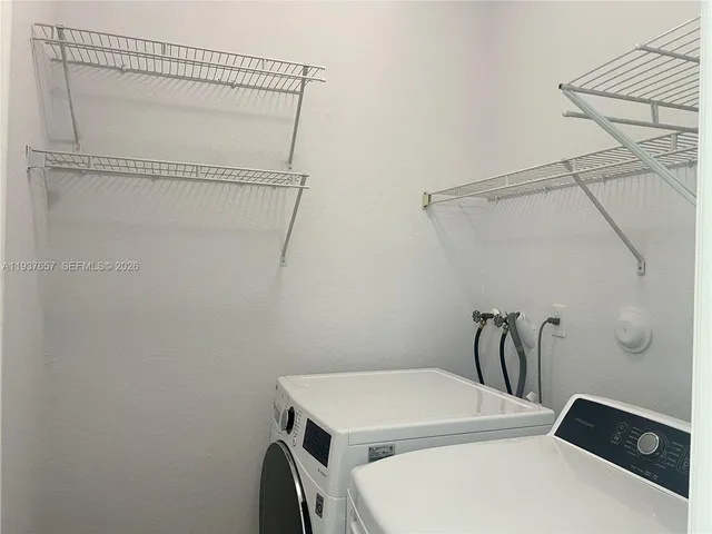 a utility room with dryer and washer