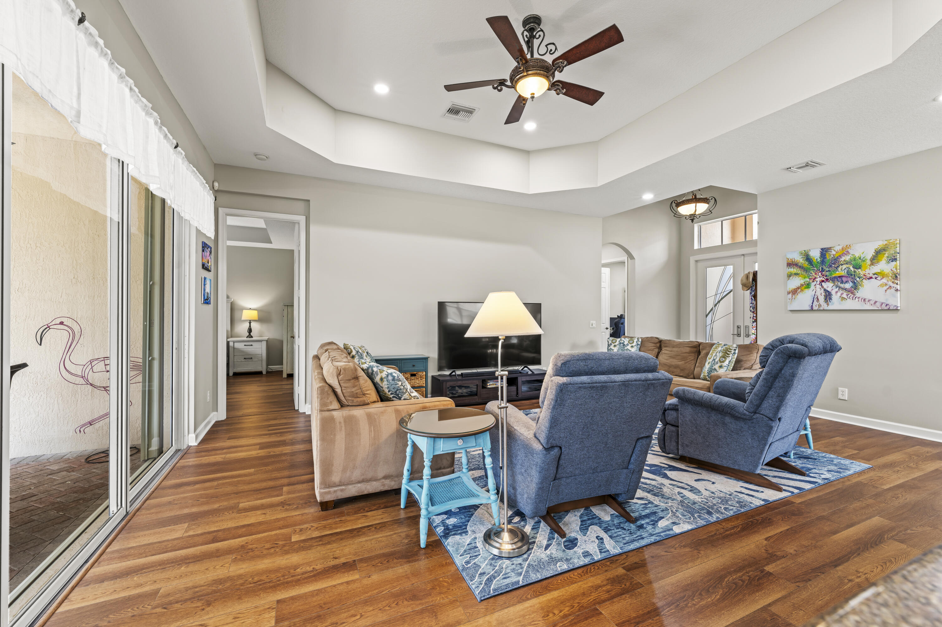 9184 Pumpkin Ridge Port St. Lucie, FL 34986 - Photo 12 of 74 a living room with furniture and a wooden floor