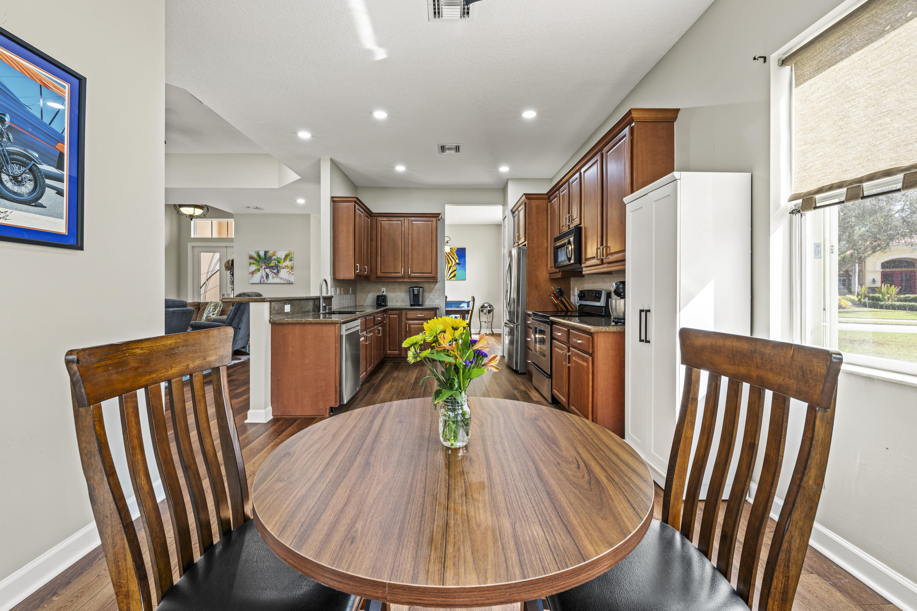 9184 Pumpkin Ridge Port St. Lucie, FL 34986 - Photo 20 of 74 a view of a kitchen with dining area