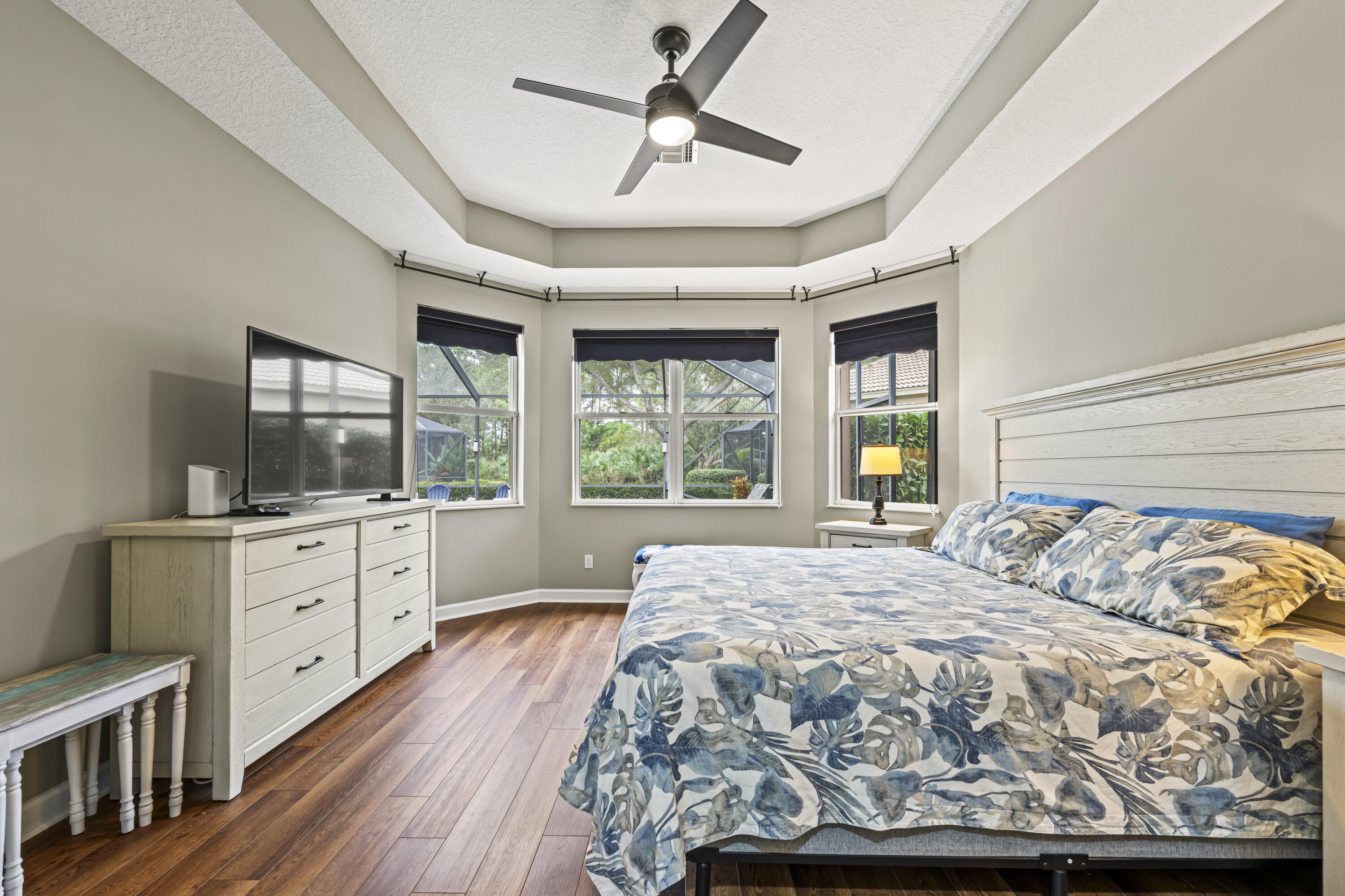 9184 Pumpkin Ridge Port St. Lucie, FL 34986 - Photo 23 of 74 a bedroom with a large bed and a large window