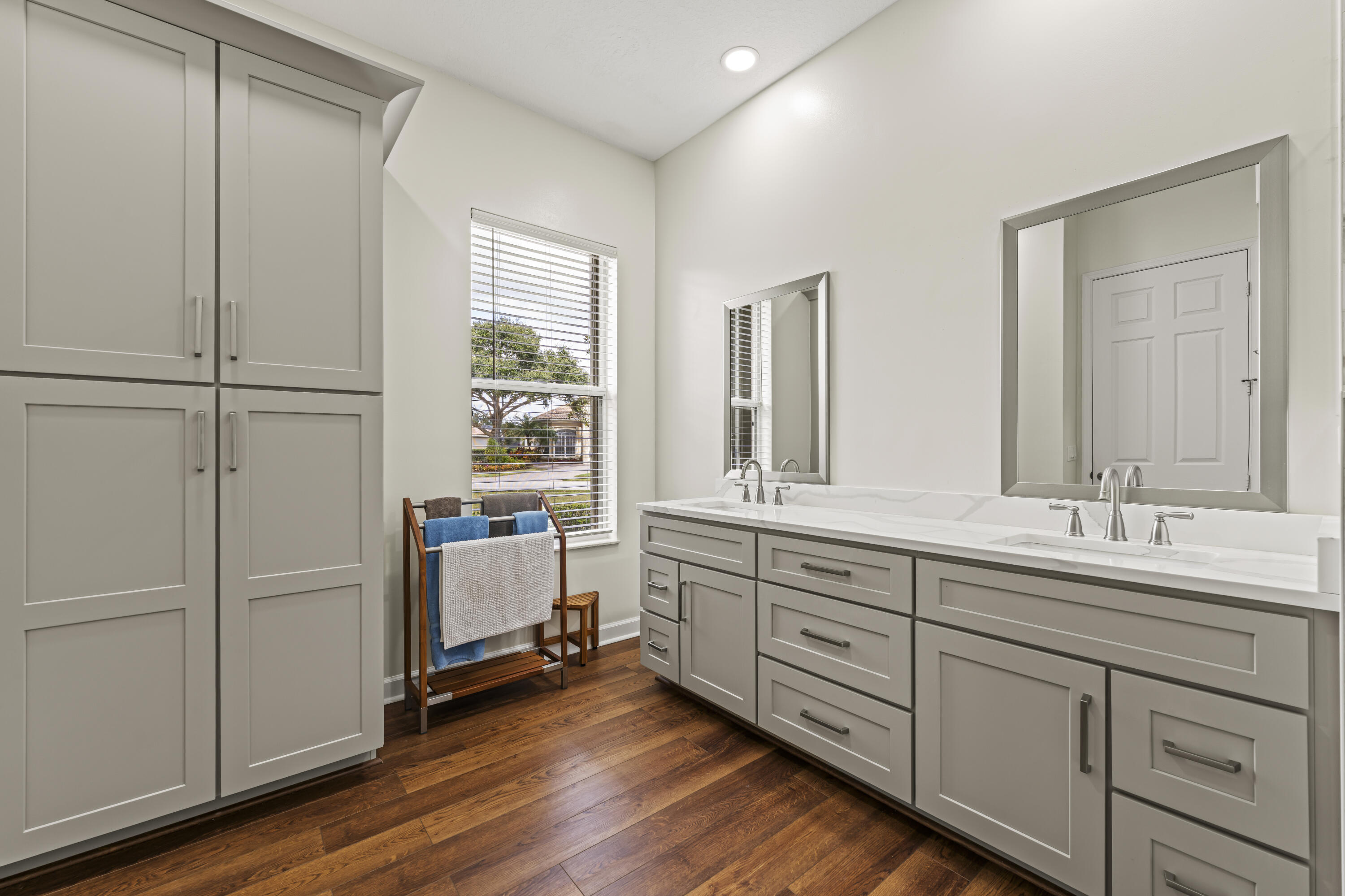 9184 Pumpkin Ridge Port St. Lucie, FL 34986 - Photo 29 of 74 a bathroom with a double vanity sink and mirror