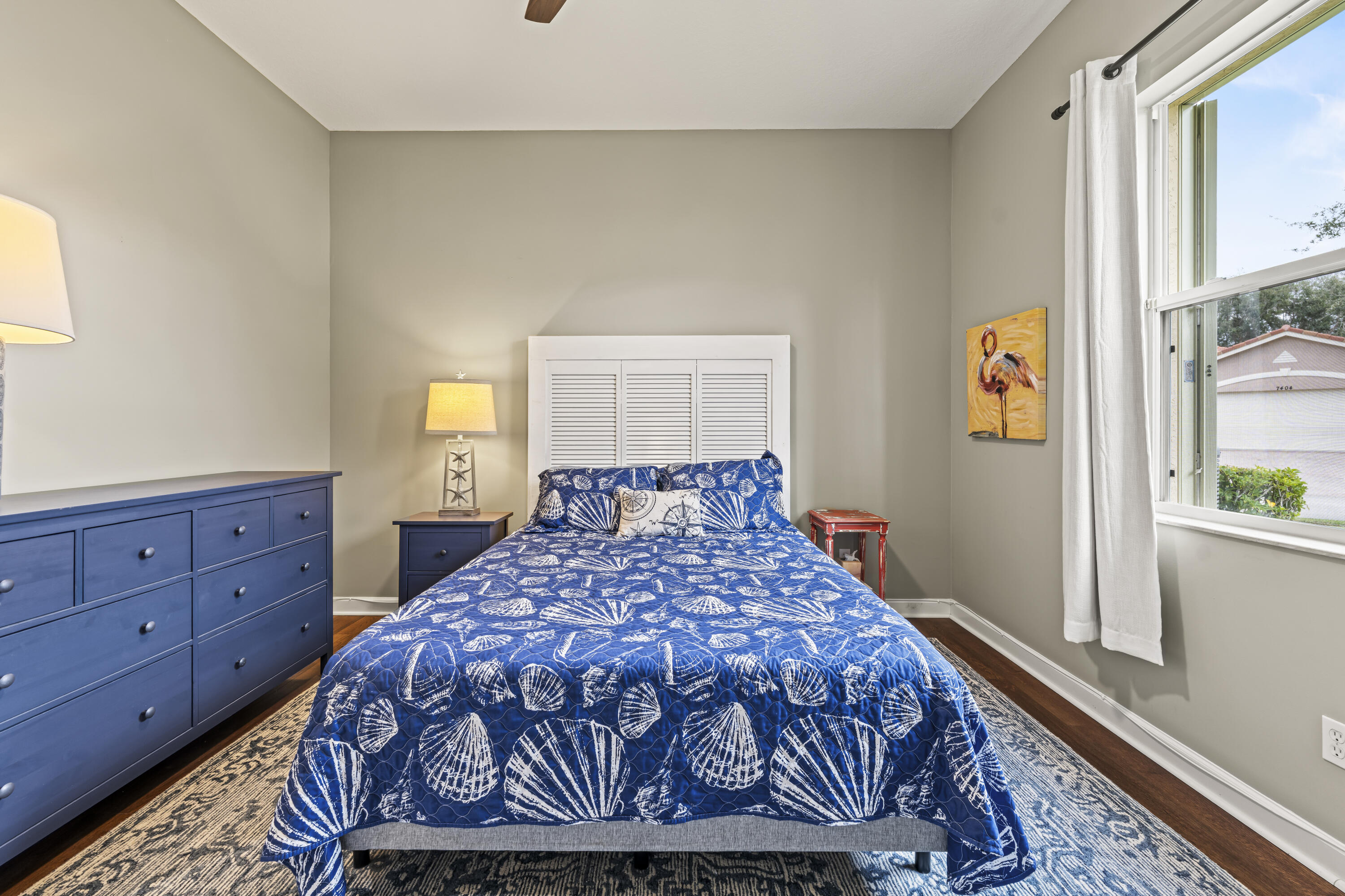 9184 Pumpkin Ridge Port St. Lucie, FL 34986 - Photo 32 of 74 a bed sitting in a bedroom next to a window