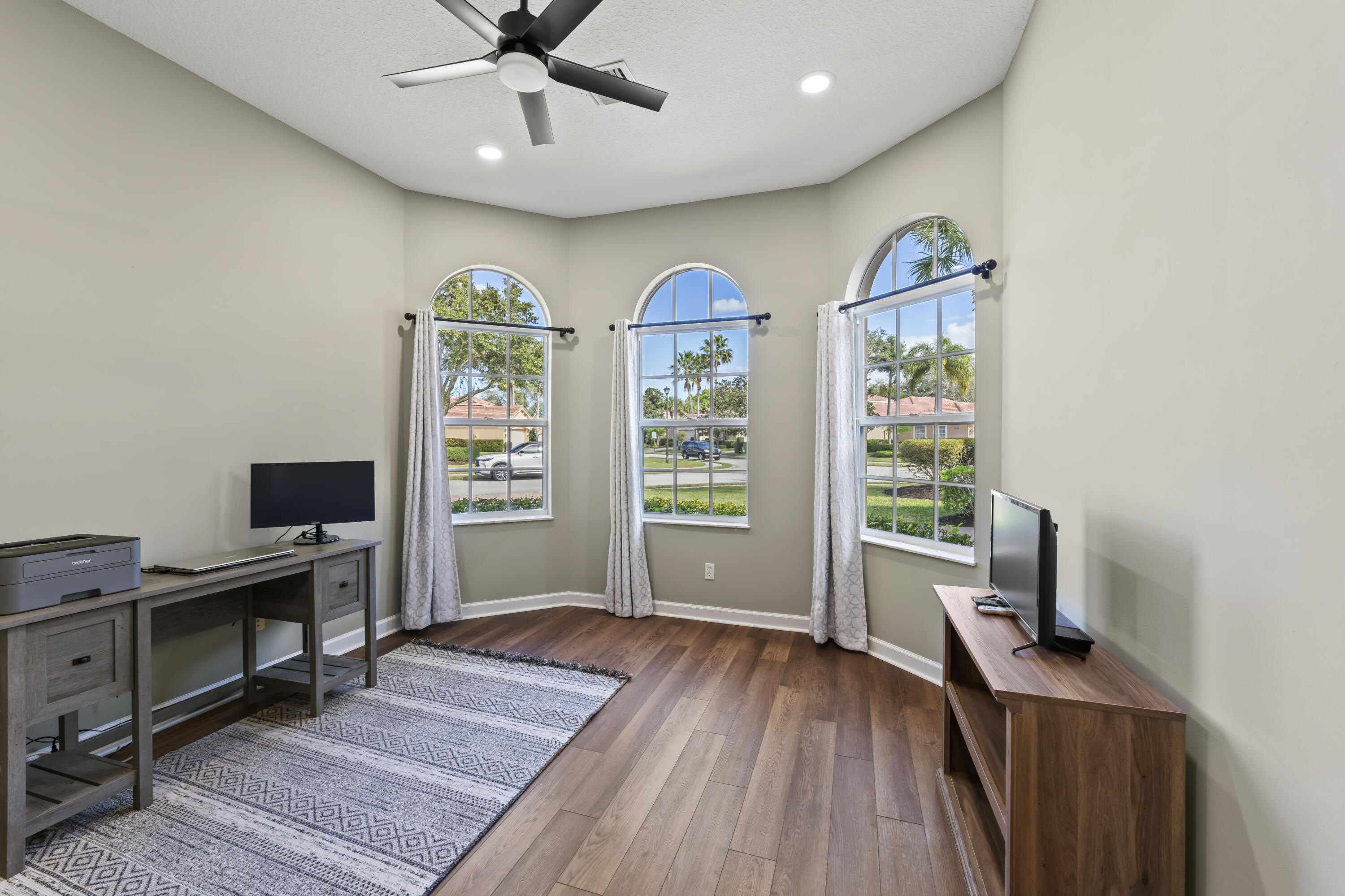 9184 Pumpkin Ridge Port St. Lucie, FL 34986 - Photo 36 of 74 a view of workspace with wooden floor windows