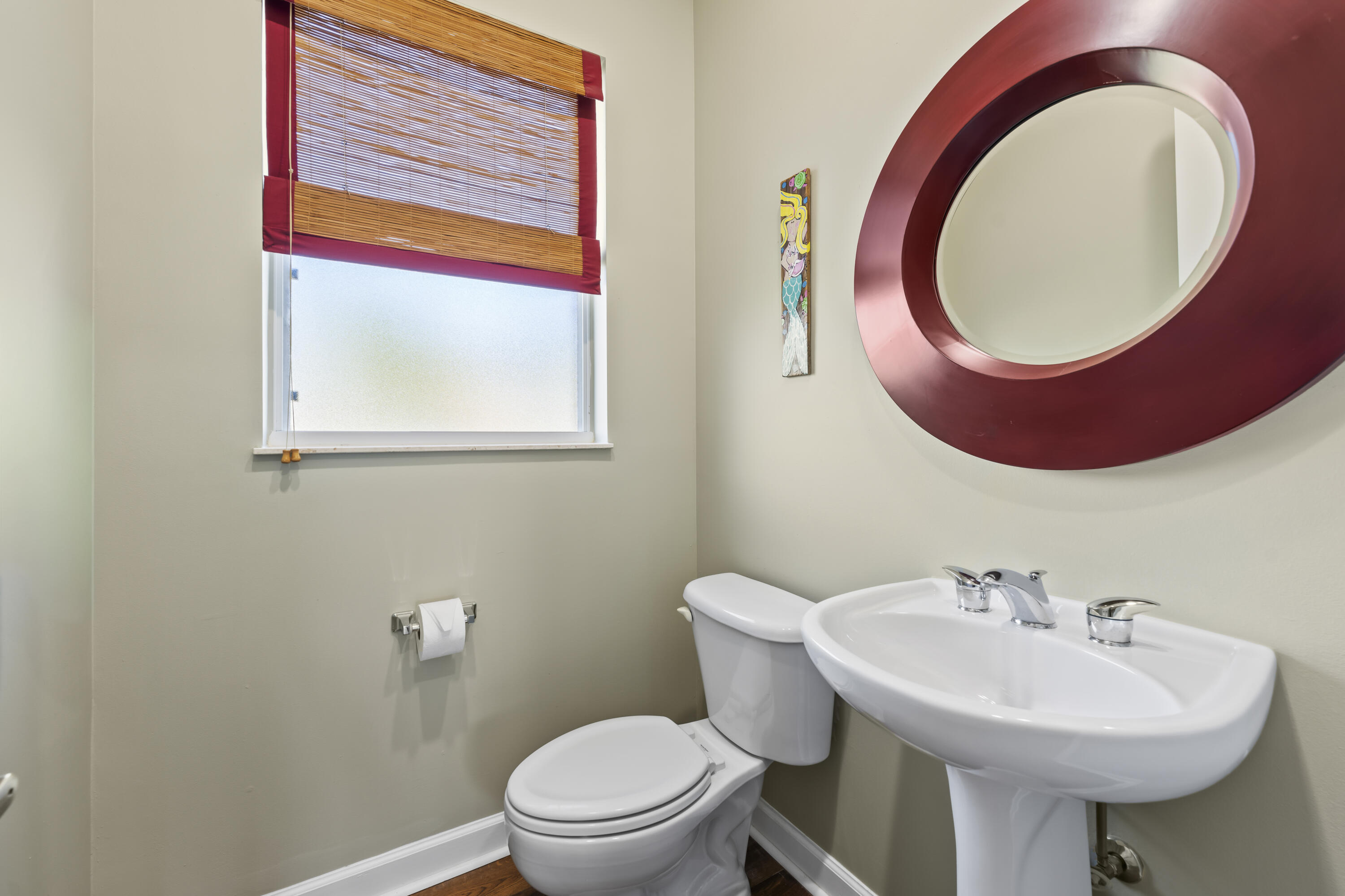 9184 Pumpkin Ridge Port St. Lucie, FL 34986 - Photo 38 of 74 a bathroom with a sink a toilet and mirror