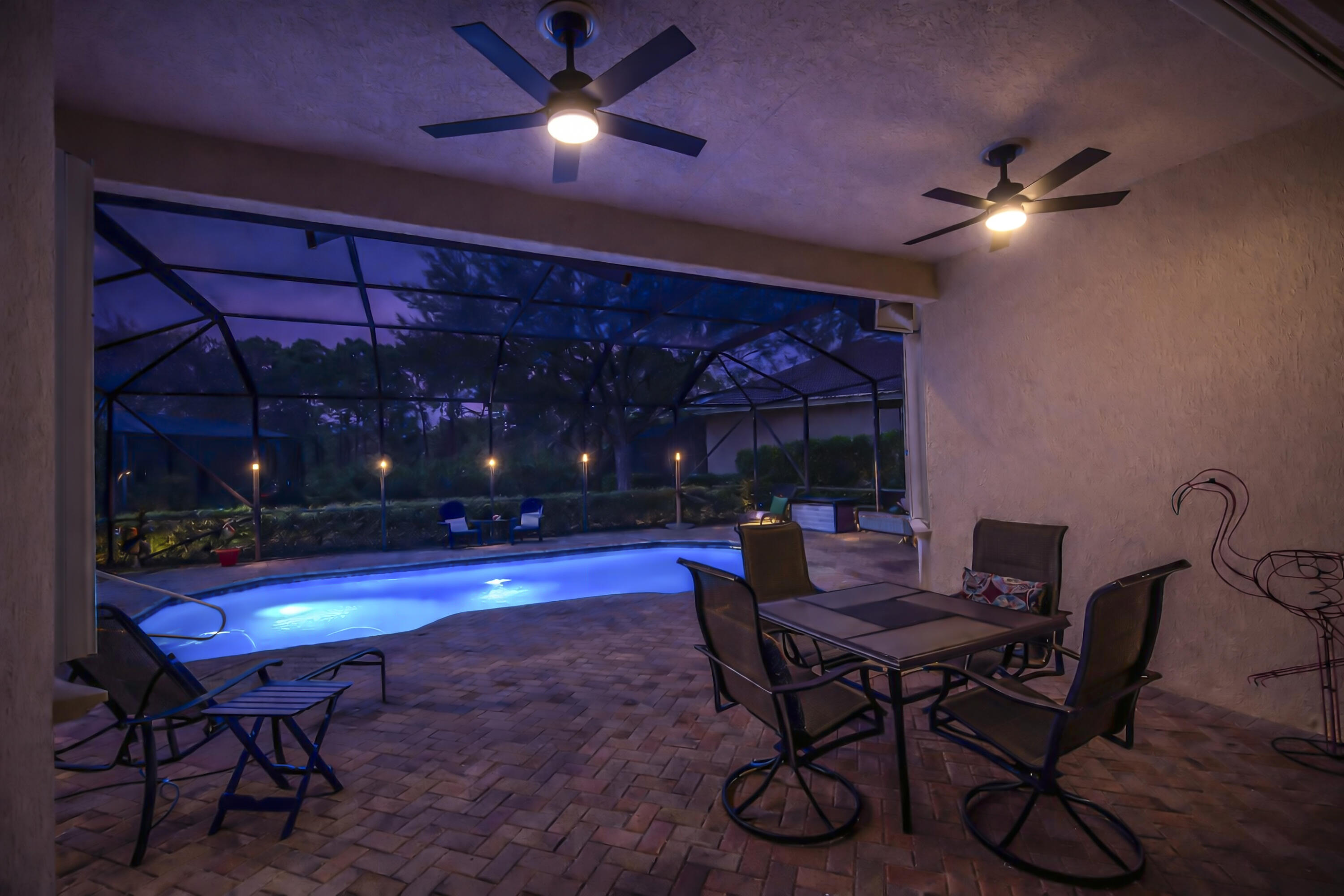 9184 Pumpkin Ridge Port St. Lucie, FL 34986 - Photo 43 of 74 a view of a dining room with furniture and chandelier