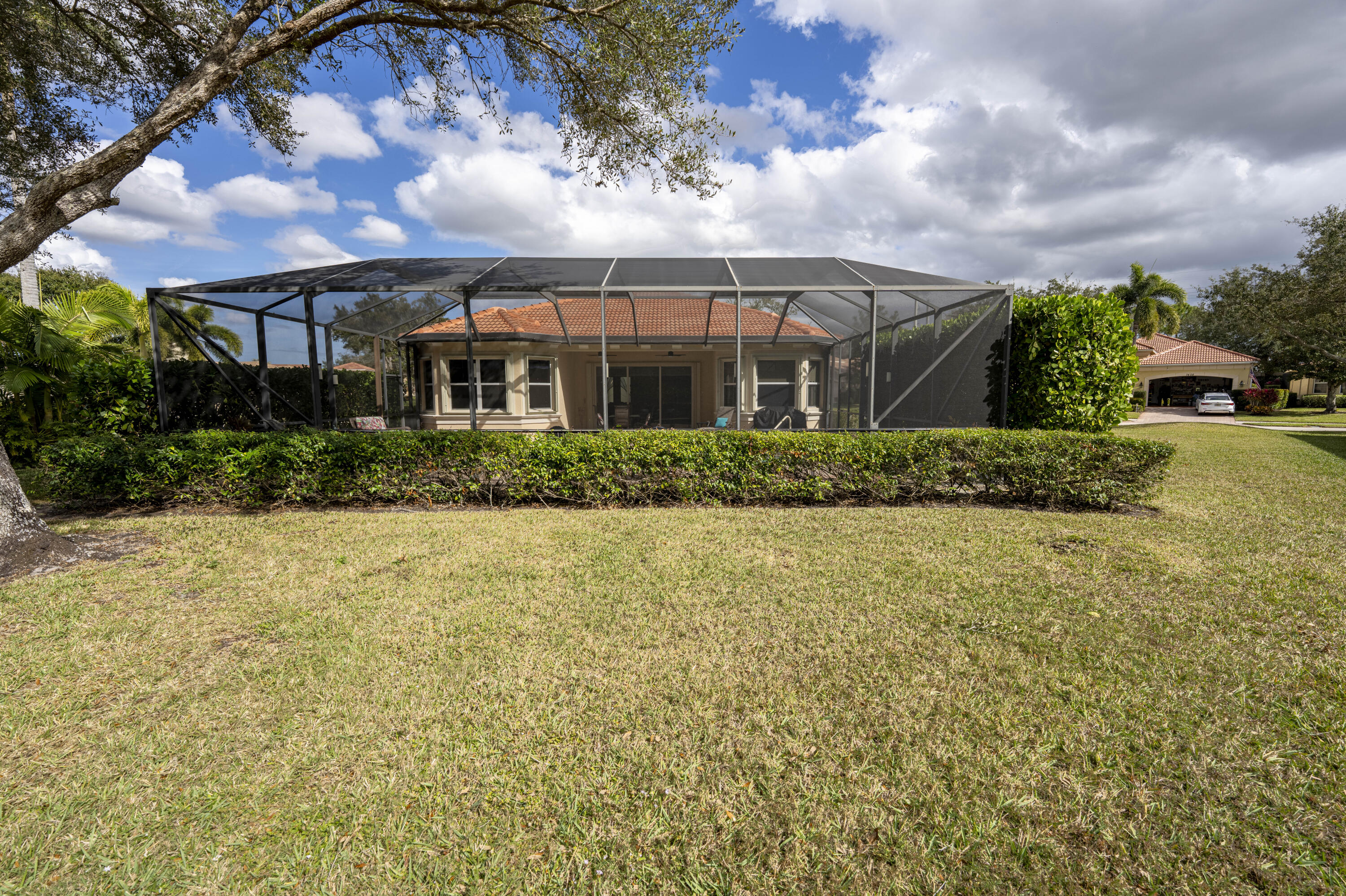 9184 Pumpkin Ridge Port St. Lucie, FL 34986 - Photo 52 of 74 a front view of house with yard and green space