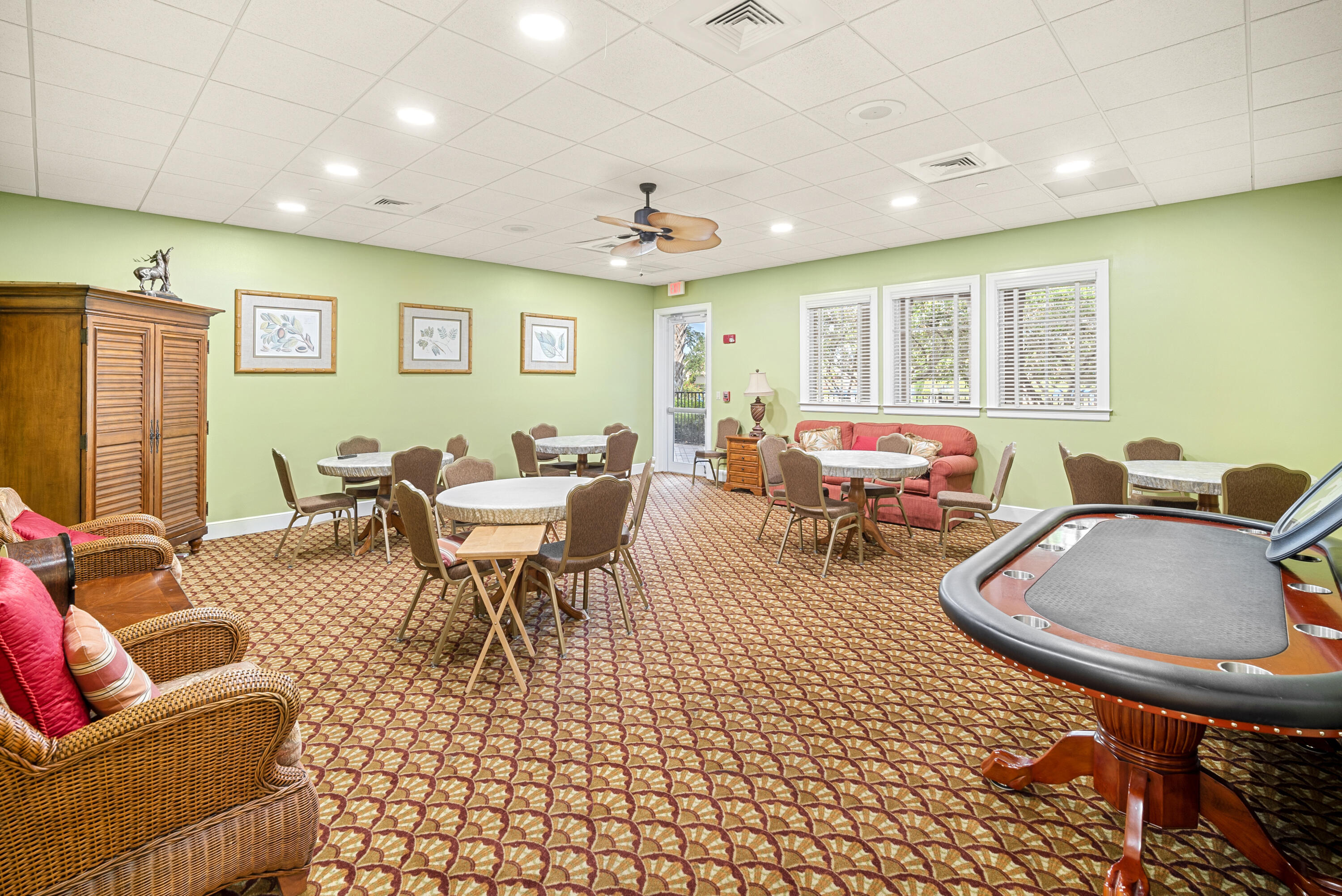 9184 Pumpkin Ridge Port St. Lucie, FL 34986 - Photo 68 of 74 a living room with furniture a window and a flat screen tv