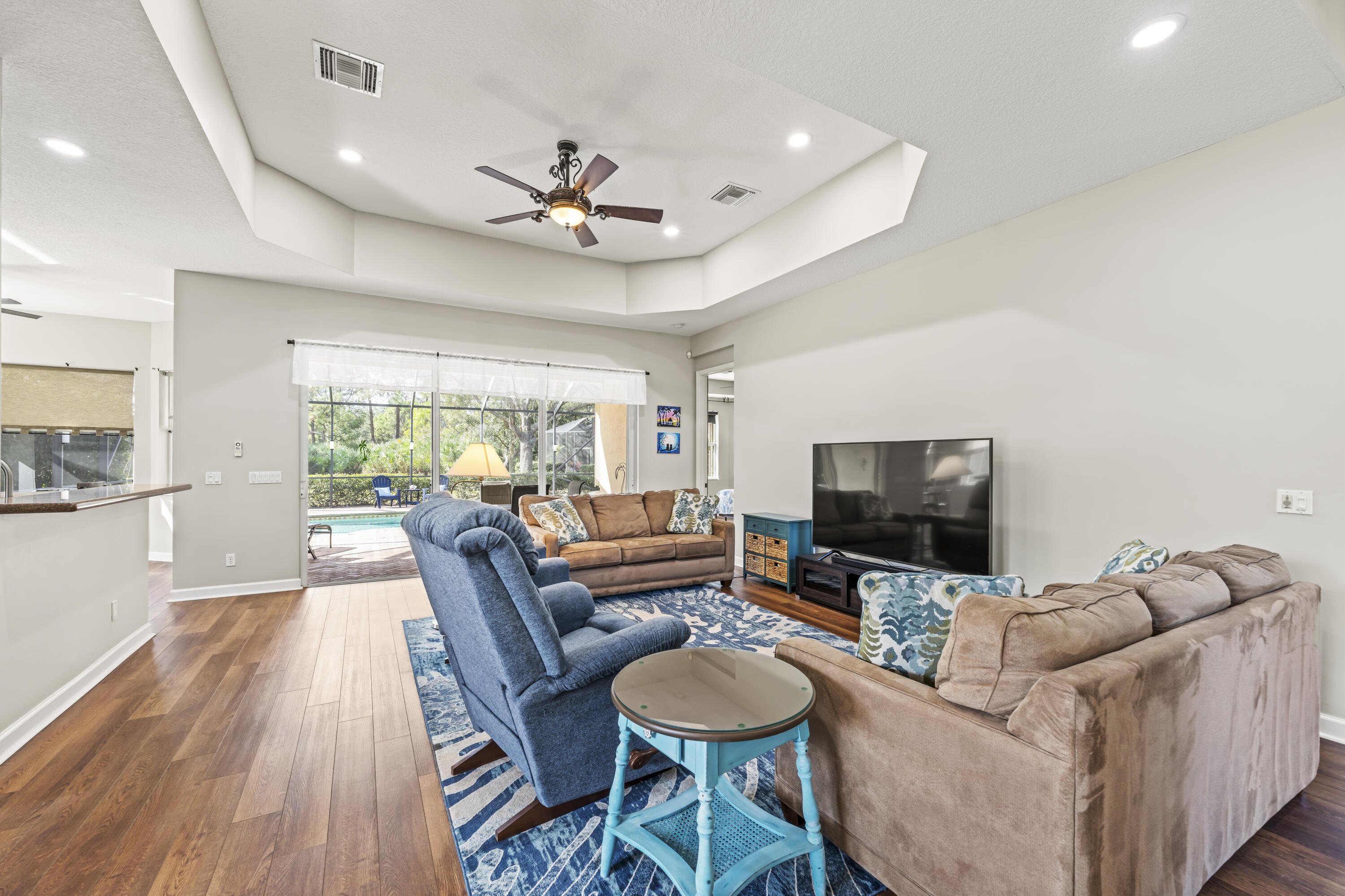 9184 Pumpkin Ridge Port St. Lucie, FL 34986 - Photo 10 of 74 a living room with furniture and a flat screen tv