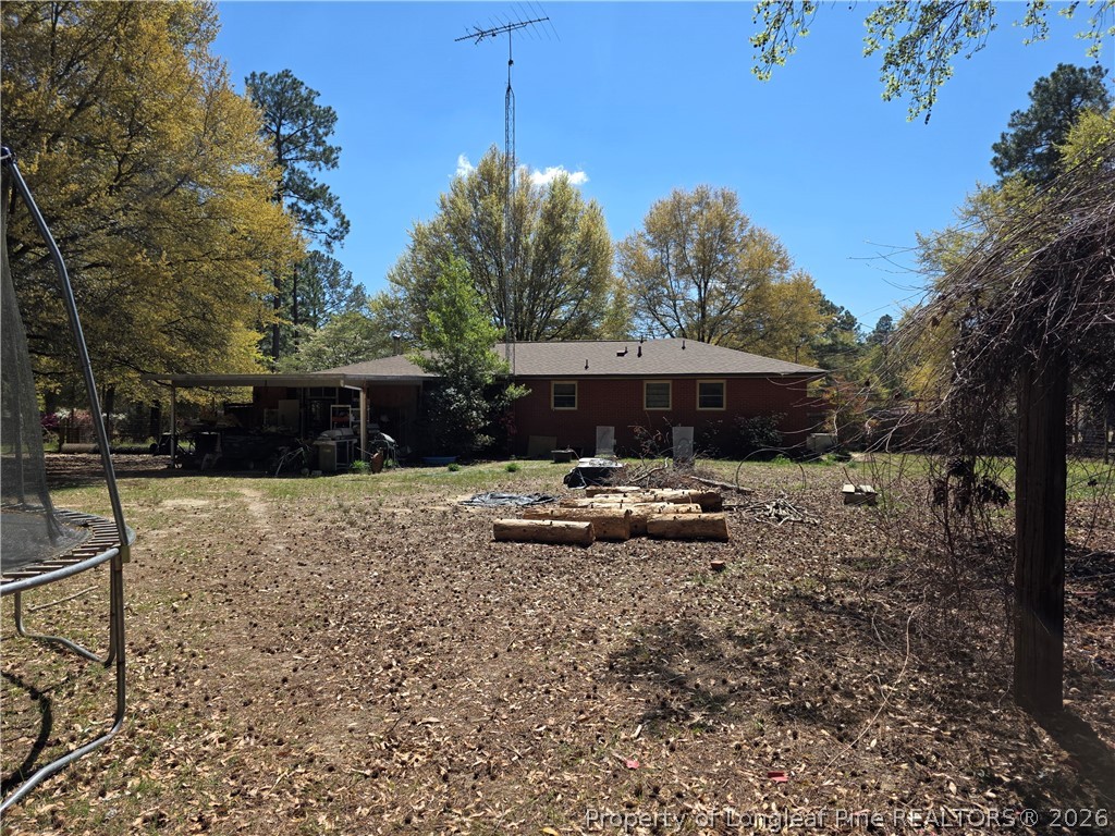 5354 Muscat Road Hope Mills, NC 28348 - Photo 2 of 12 a view of a house with backyard and sitting area