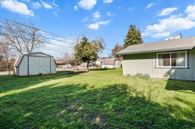 a front view of house with garden