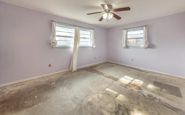 a view of empty room with windows