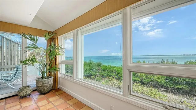 a entryway view with a potted plant in front of a glass door