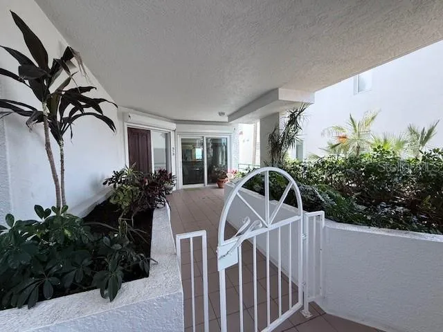 a kitchen with white cabinets and appliances