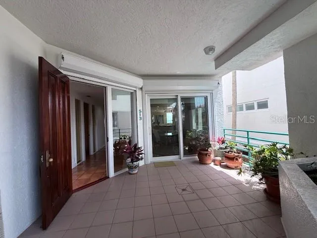 a kitchen with white cabinets and appliances