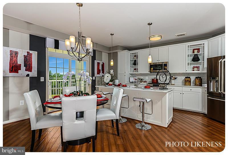 a view of kitchen with stainless steel appliances granite countertop a stove a sink dishwasher and a refrigerator