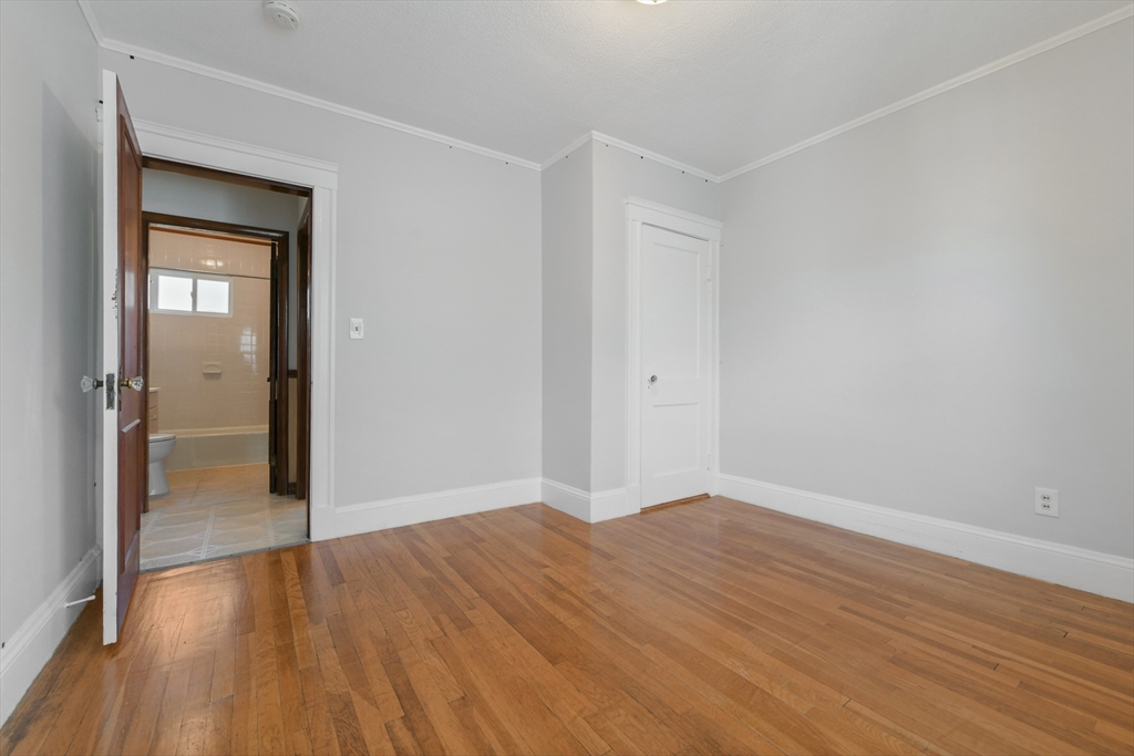 331-333 Vermont Street Boston, MA 02132 - Photo 20 of 26 wooden floor in an empty room
