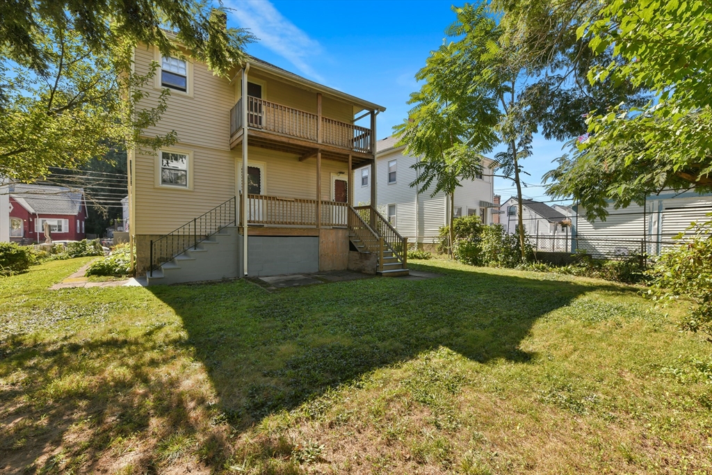 331-333 Vermont Street Boston, MA 02132 - Photo 6 of 26 a view of a back yard of the house