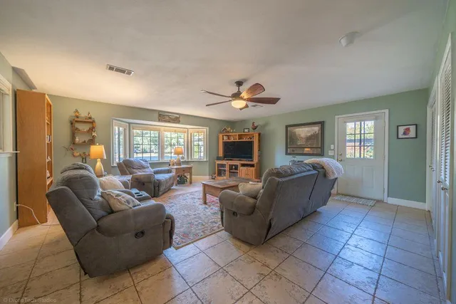 a living room with furniture and a window