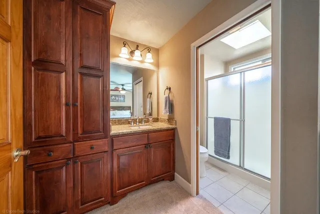 a view of a bathroom from the hallway