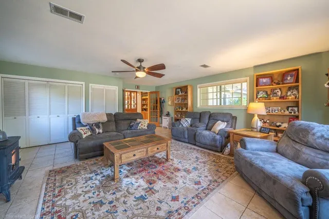 a living room with furniture and a window